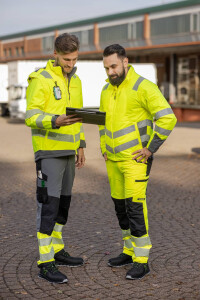 Werbung für Sicherheitskleidung mit zwei Modellen.jpg